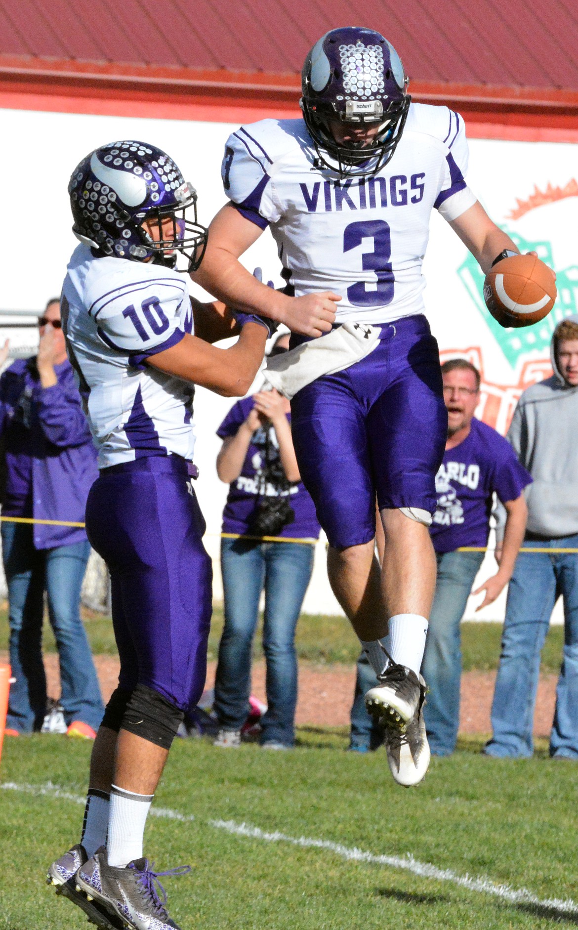 CHARLO HIGH School QB Landers Smith (right) and Trent Dennison (left) celebrate after scoring a touchdown in the Class-C, 8-man semifinal 50-35 victory over Belt Saturday afternoon at Belt High School&#146;s football field. (Jason Blasco/Lake County Leader)