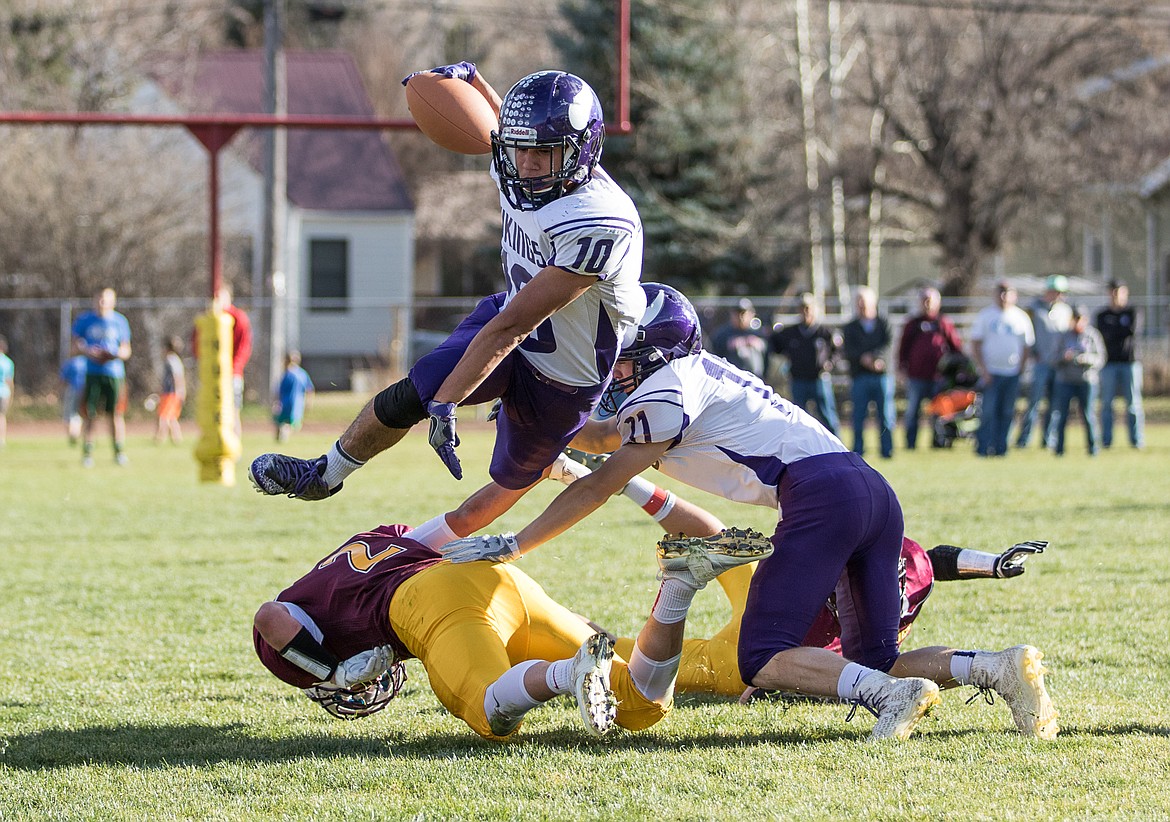 Photo courtesy of Kylie Richter
Charlo&#146;s Trent Dennison hurdles a Belt defender during the Class C semifinal football game on Saturday in Belt. The Vikings won 50-35 to advance to the state championship game, which will be in Charlo this coming Saturday.