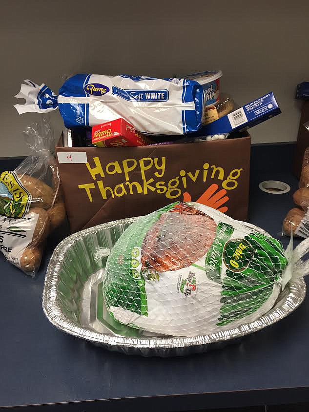 Courtesy photo
The Chief Moses Middle School leadership class raised money and food for 23 Thanksgiving baskets for their classmates.