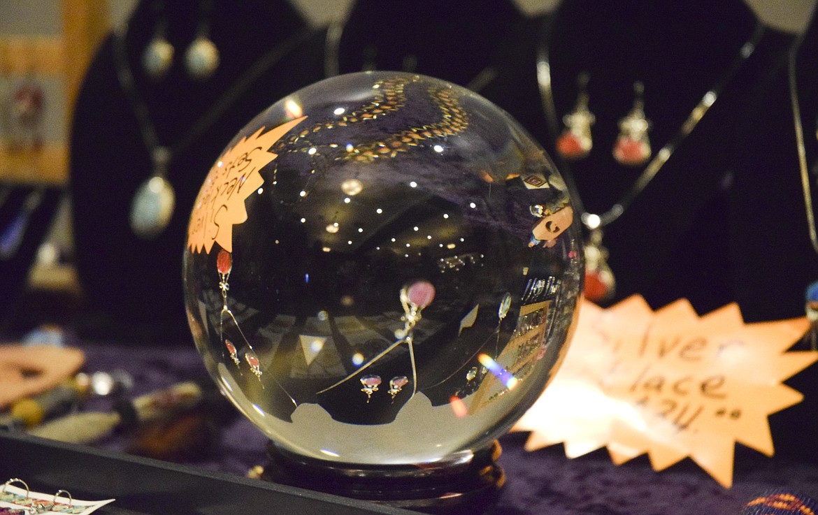 A GLASS ball reflects jewelry at the KwaTaqNuk Resort&#146;s Holiday Bazaar on Friday.