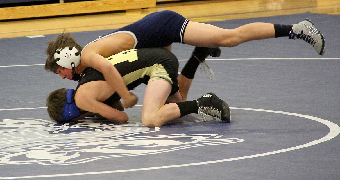 &#151;Photo by DAC COLLINS
BCMS wrestler Evan Baragas, pictured here on top of a Kellogg wrestler. shows how to execute a proper pin quickly during the home match that took place on Thursday, Nov. 17. Step one: get control of your opponent and drive them into the mat.