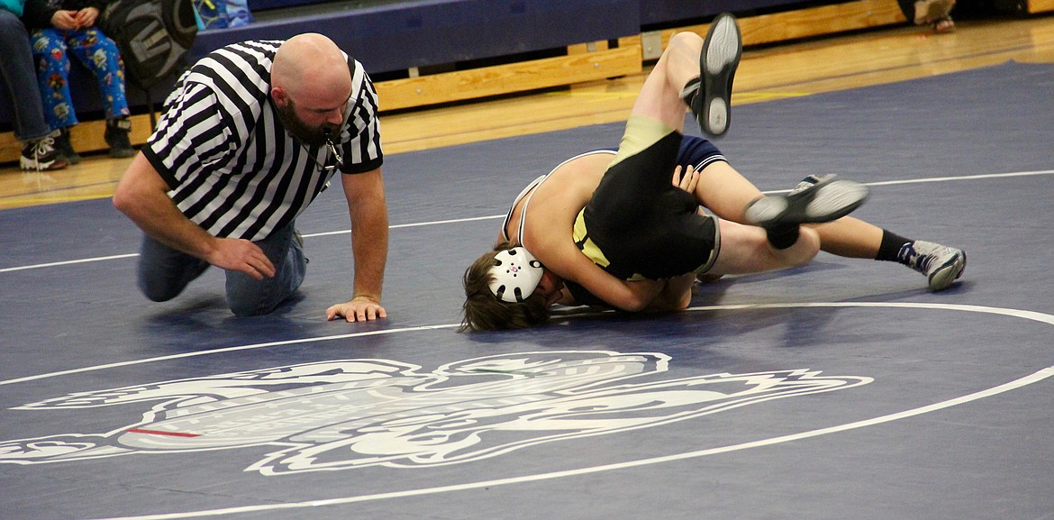 &#151;Photo by DAC COLLINS
Step two: wrap up your opponent and hold on tight for the pin.