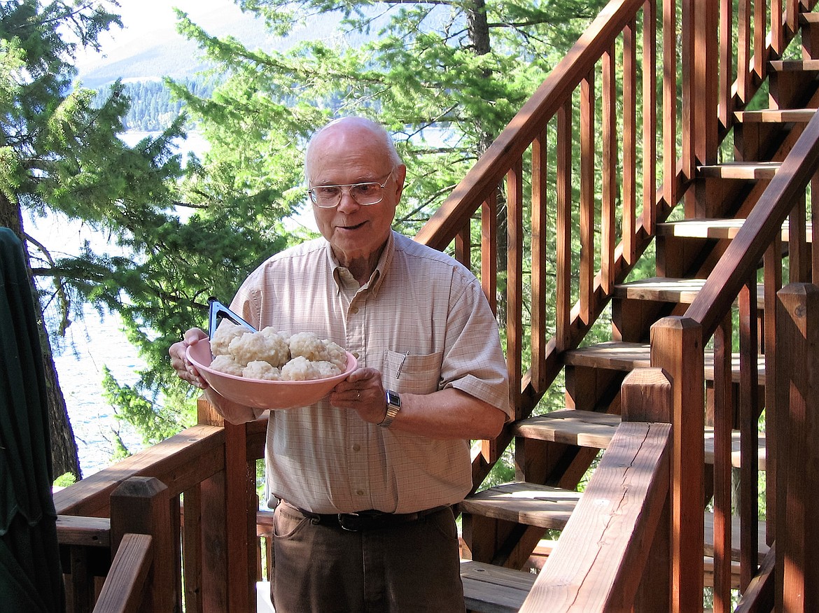 Ralph Ammondson serves potato dumplings during a family gathering.