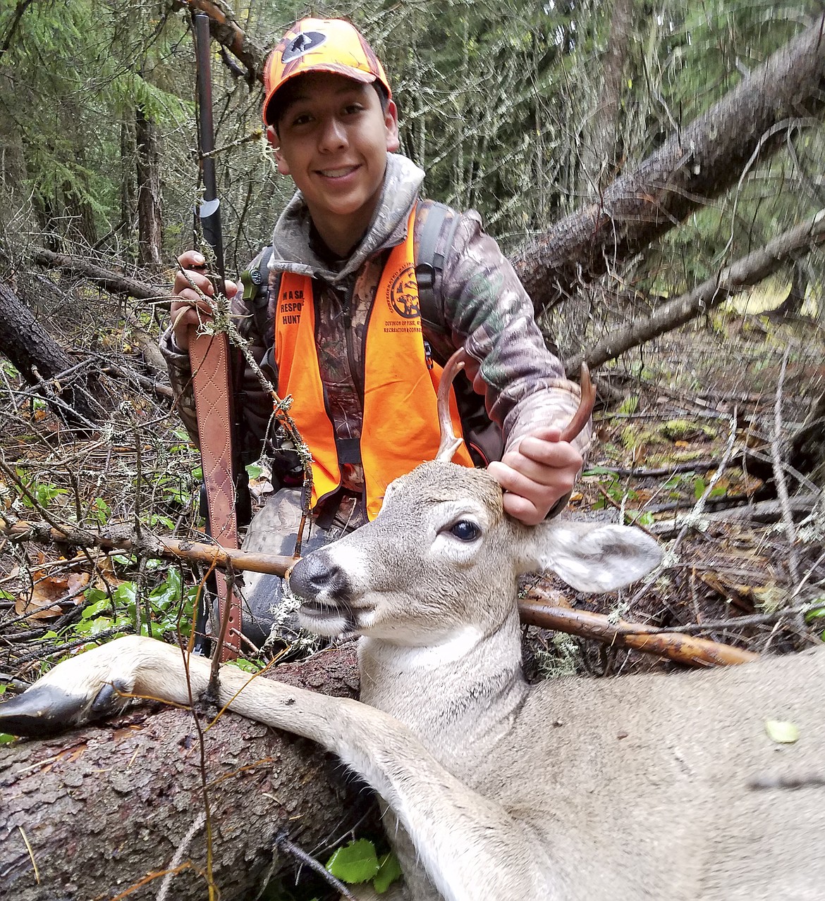 VICTOR PEREZ CARRILLO poses with his first deer. (Photo courtesy of Tom Fieber)