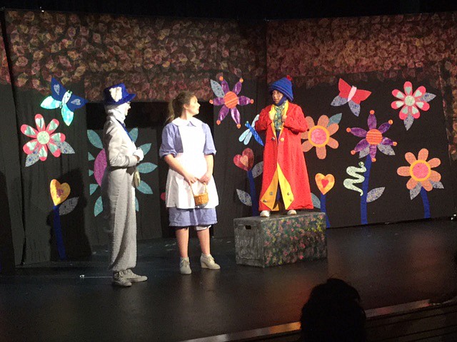 Ted Escobar/The Sun Tribune - Far left is one of the MCT Actresses, with Tall Alice (Isabelle Yorgesen), and Humpty Dumpty (Jordan Buck).