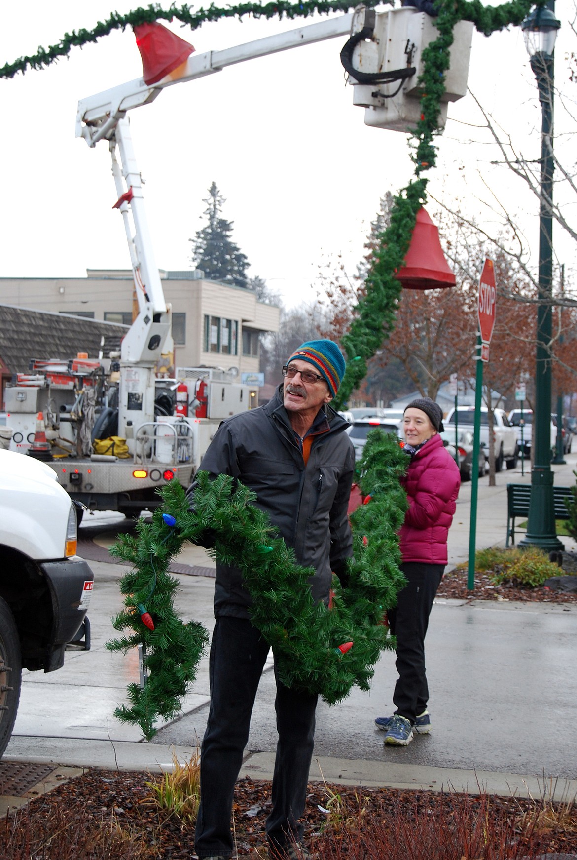 Volunteers descended on downtown Whitefish Sunday morning to hang up the winter decorations.