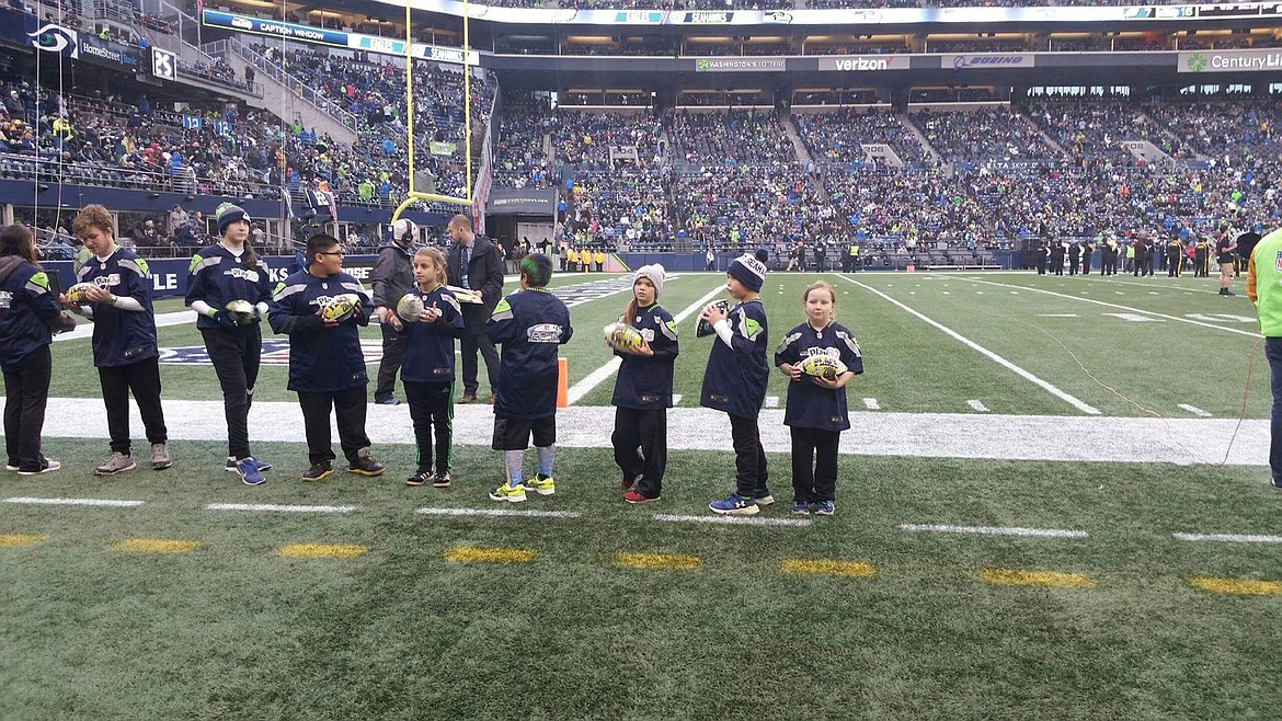 HAILEY LOWE, far right, of Thompson Falls is recognized as a regional Punt, Pass and Kick competition winner on Sunday, Nov. 20 at CenturyLink Field in Seattle. (Courtesy photo)