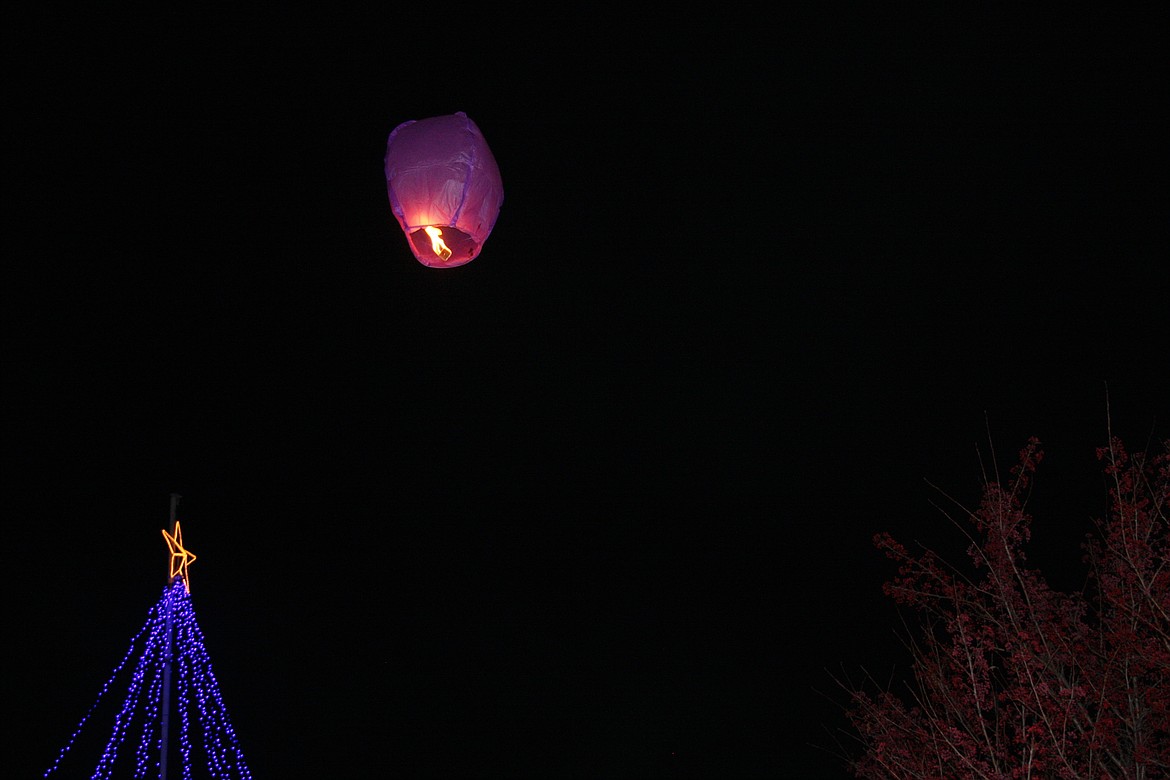 A LANTERN soars above a Christmas tree on Saturday, Nov. 26 at the Sanders County Fairgrounds. (Clark Fork Valley Press photo)