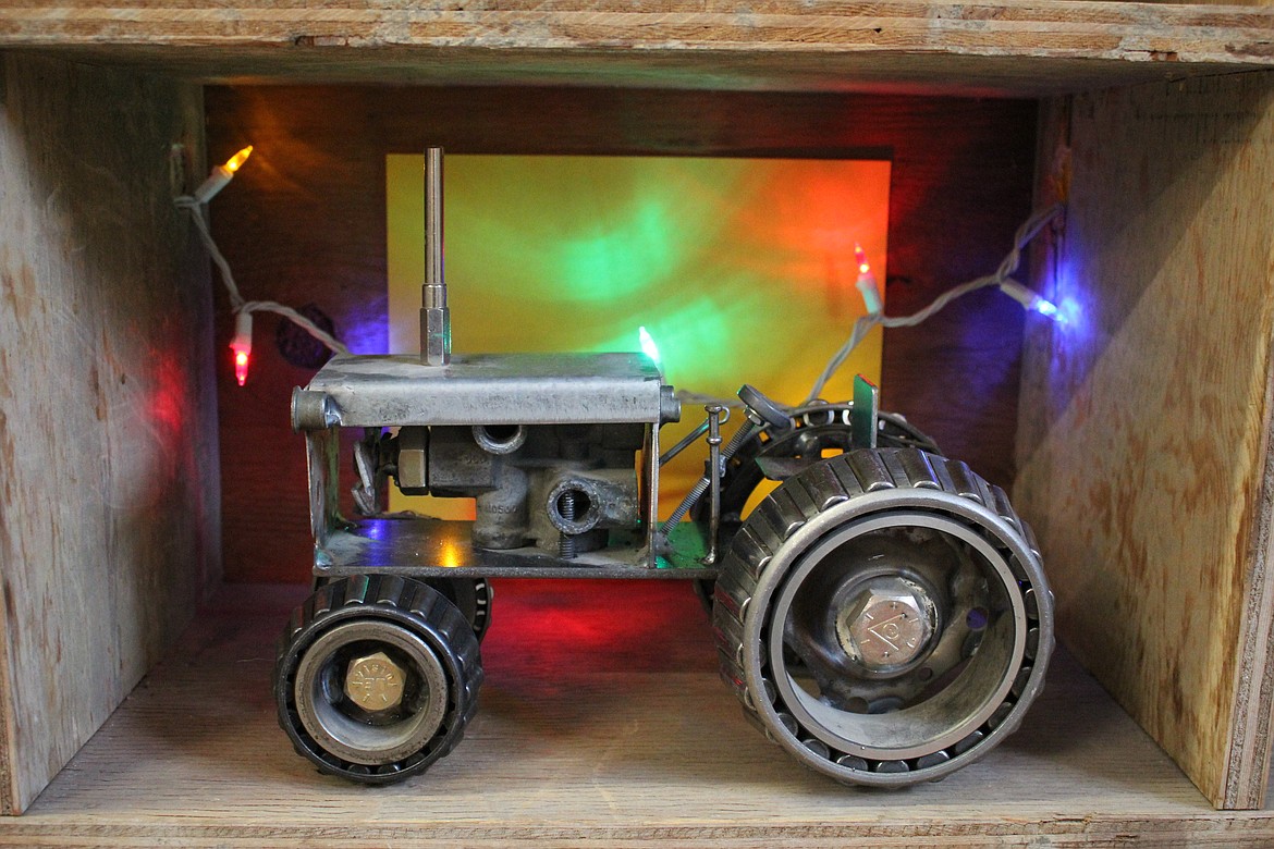 A tractor made out of truck parts is a unique gift not found in box stores and encourages people to shop local. (Photo by Kathleen Woodford/Mineral Independent)