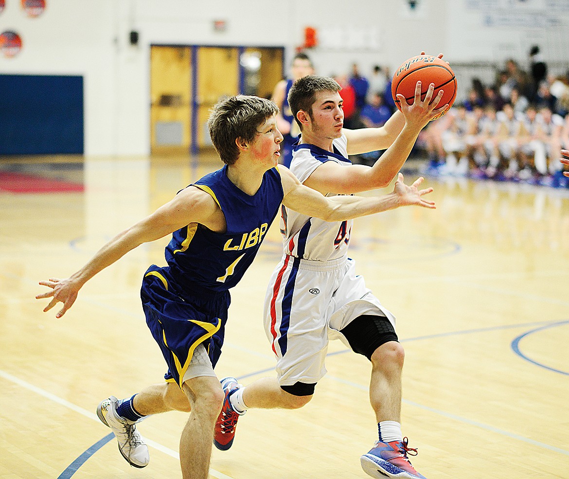 Will Johnson snares a loose ball against Libby&#146;s Jonny Cielak