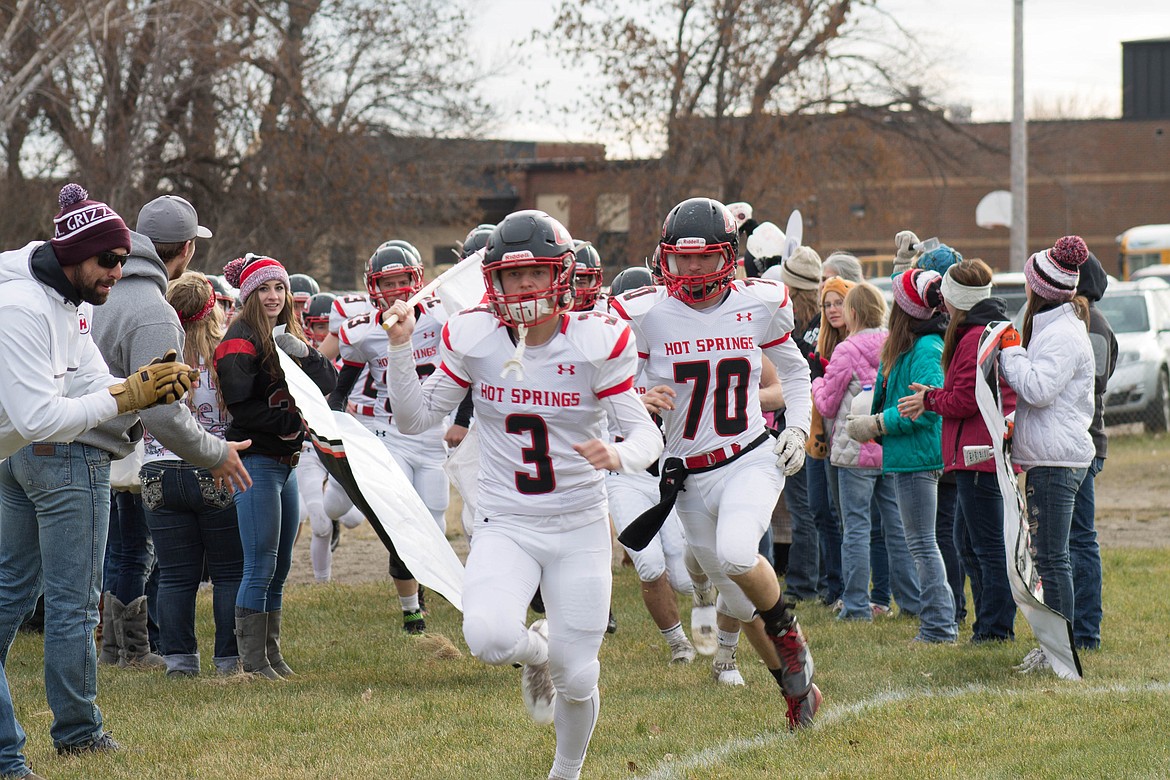 ALL-STATE seniors Trevor Paro (3) and Sean Shea (70) lead Hot Springs to the field at the Class C six-man state championship game Saturday, Nov. 19, in Plentywood. (Photo courtesy of Julie White)