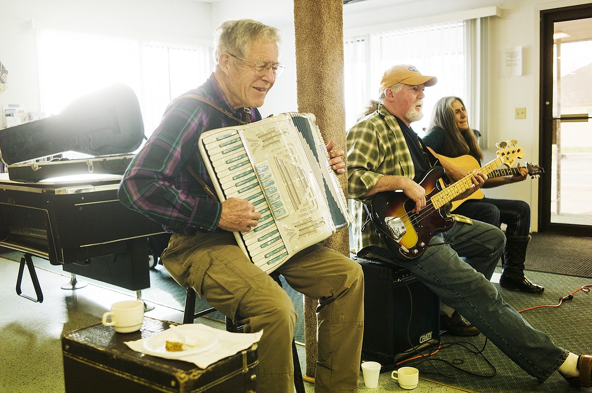 Sam Neff on accordian, Mark Souhrada on bass and Kaura Bell on acoustic guitar. And yes, that is a slice of pumpkin pie.