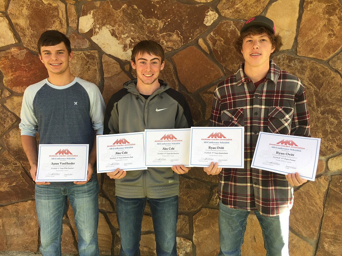 PLAINS SENIORS (from left) Aaren VonHeeder, Alec Cole and Ryan Ovitt hold up their all-conference awards. (Courtesy photo)