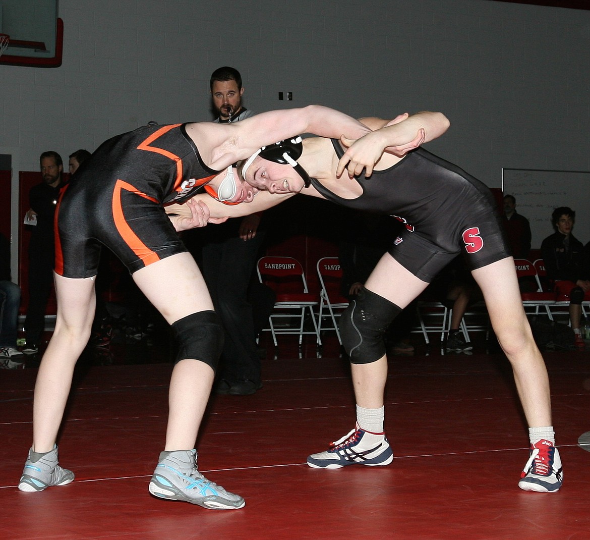 &#151;Photo by ERIC PLUMMER
Bulldog sophomore Micah Holub, right, ties up with Manuel Naccarato as the Bulldogs rolled over the Spartans on Tuesday night.