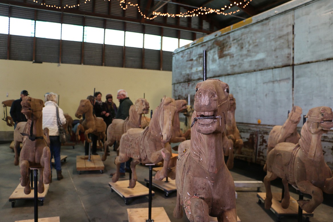 &#151;Photo by MARY MALONE
A 1920 carousel was released from its 64-year slumber Saturday by its new owners, Clay and Reno Hutchison, at the Sandpoint Granary Warehouse where about 150 people showed up to see the old machine with its hand-carved wooden horses, which after restoration, will find a home in Sandpoint.