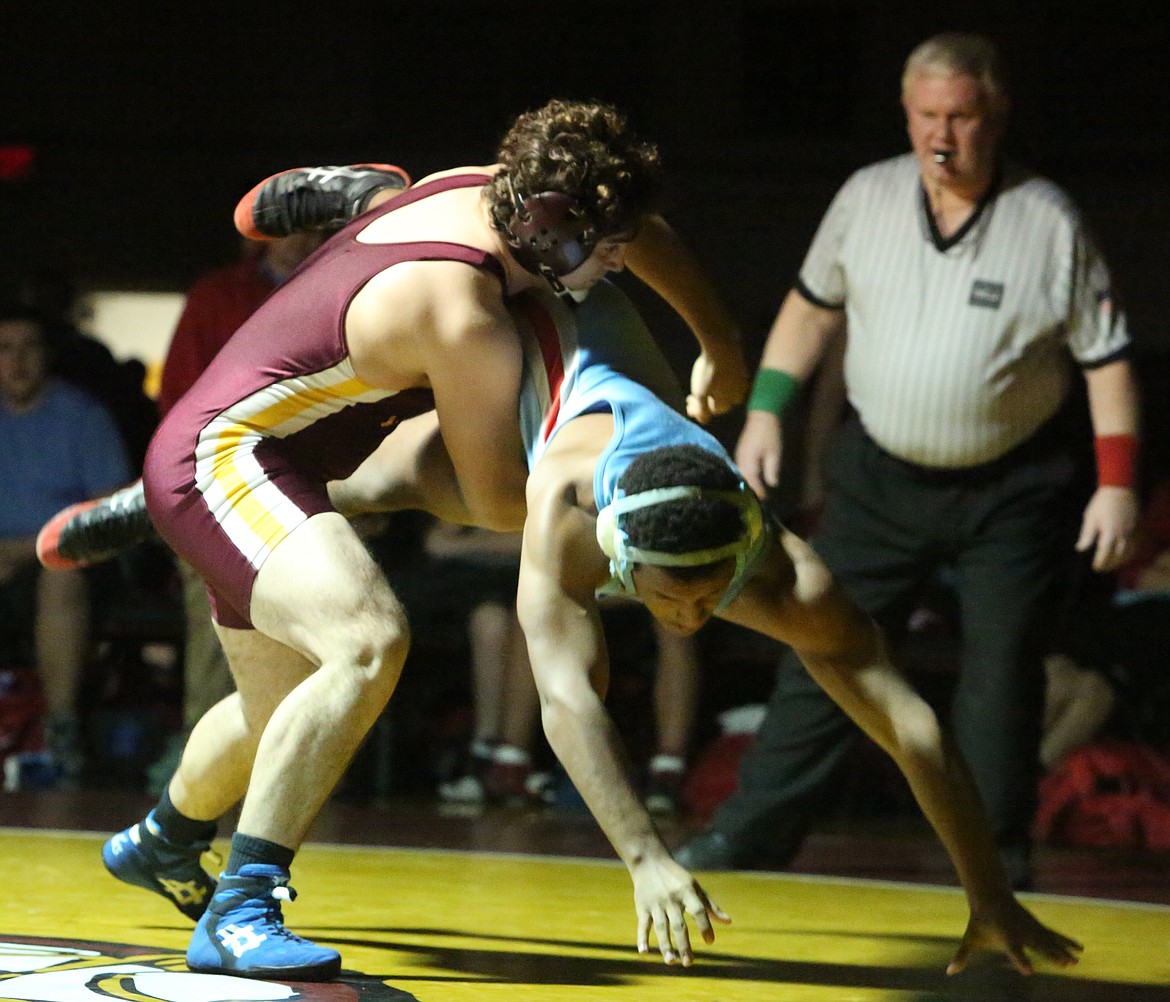 Connor Vanderweyst/Columbia Basin Herald
Moses Lake&#146;s Daiman Vasquez (maroon) takes down West Valley&#146;s Austin Jacobs.