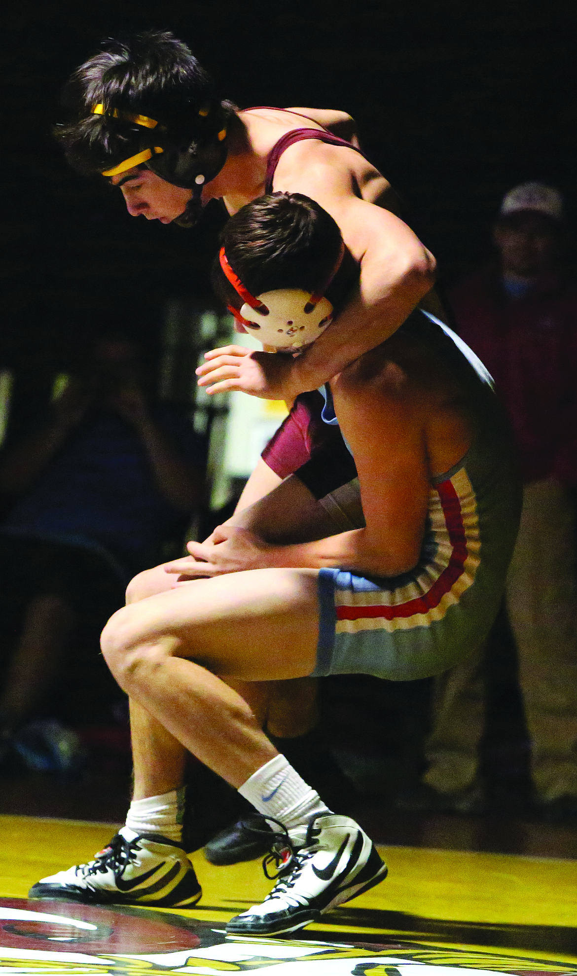 Connor Vanderweyst/Columbia Basin Herald
Moses Lake&#146;s Nick Hara (maroon) grapples with West Valley&#146;s Jamie Plumlee.