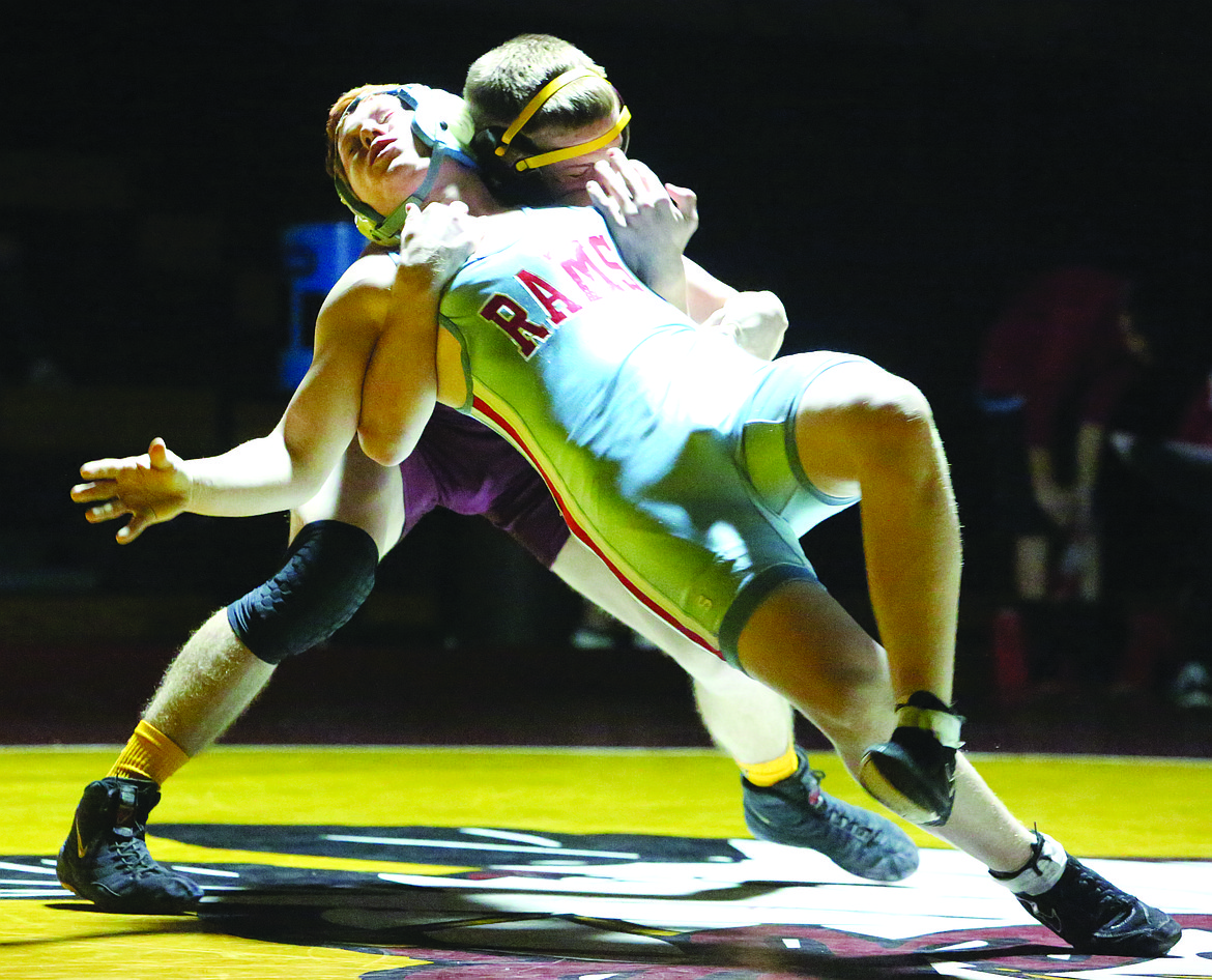 Connor Vanderweyst/Columbia Basin Herald
Moses Lake&#146;s Hunter Cruz (maroon) hangs on to West Valley&#146;s Cade Ewing for a take-down.