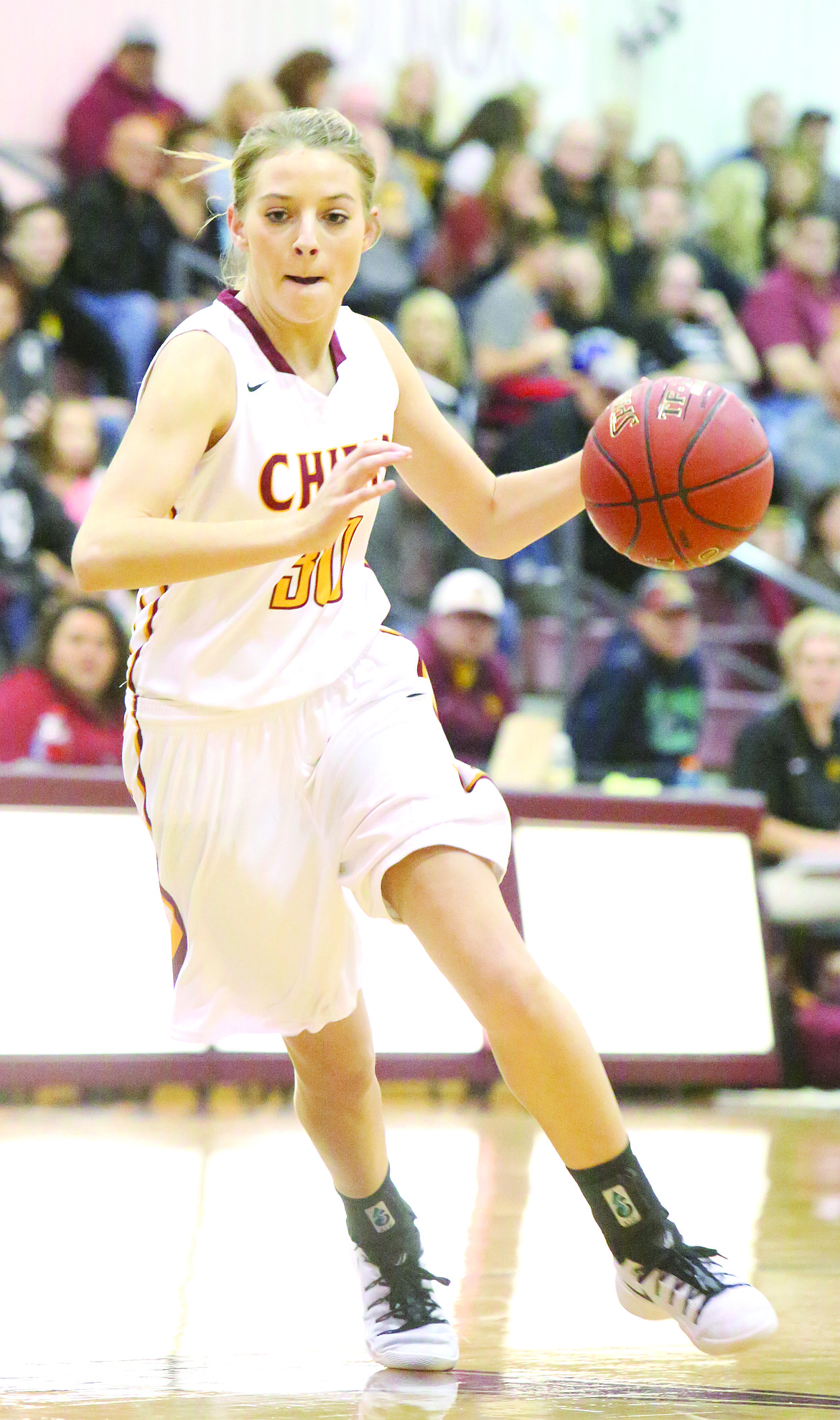 Connor Vanderweyst/Columbia Basin Herald - Moses Lake forward Jessica Olson dribbles.