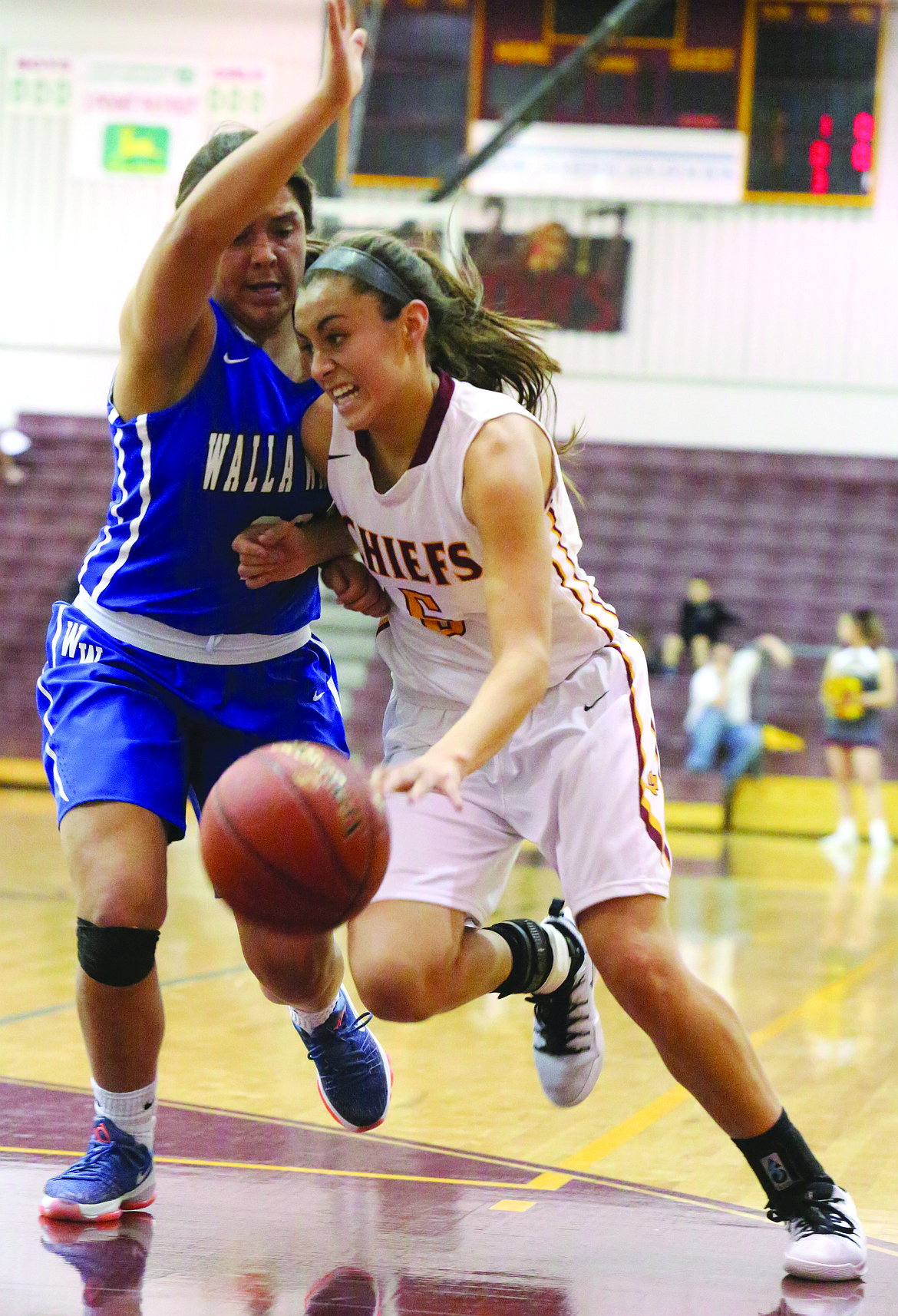 Connor Vanderweyst/Columbia Basin Herald - Moses Lake point guard Jamie Loera drives to the basket against Walla Walla.