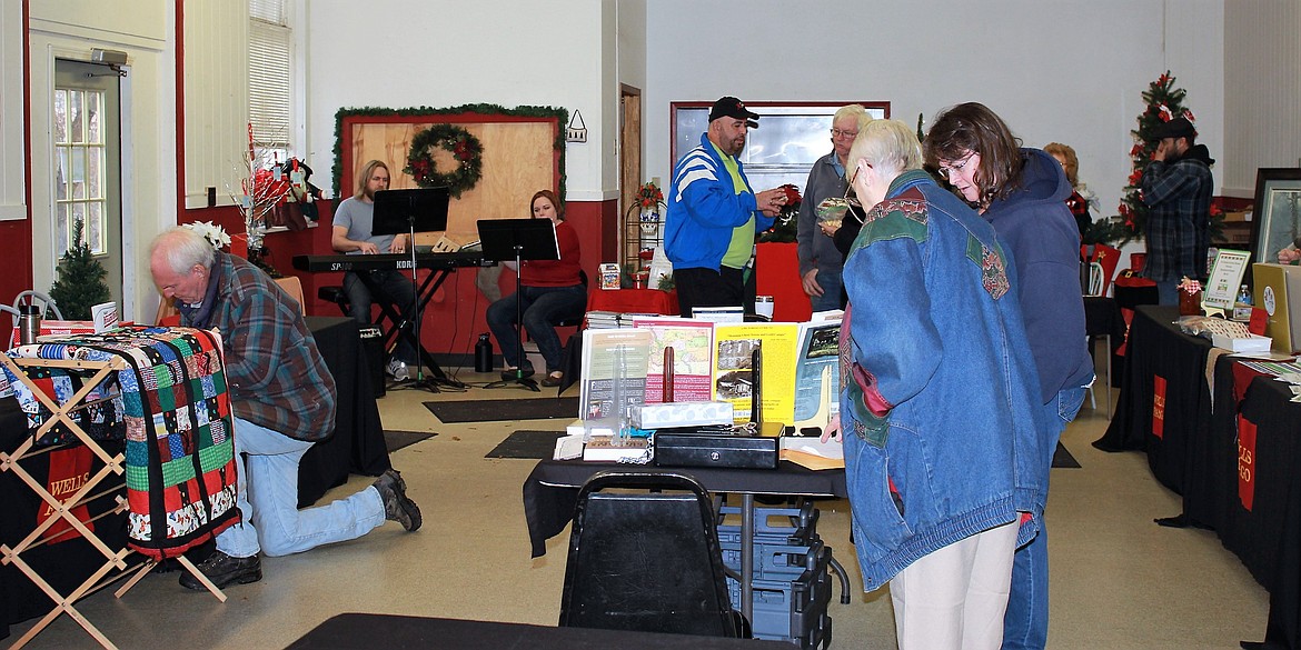 Nonprofit groups had tables in the Old Schoolhouse in Superior as part of the Wells Fargo Holiday Stroll on Dec. 3.