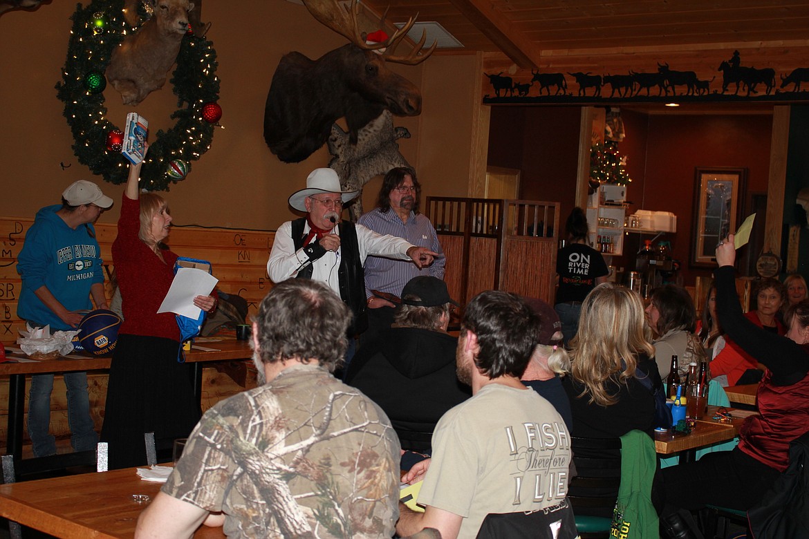 Auctioneer D.K. Mitchell helped out at the 21st Annual Helping Hands auction held at River Edge on Dec. 3.
