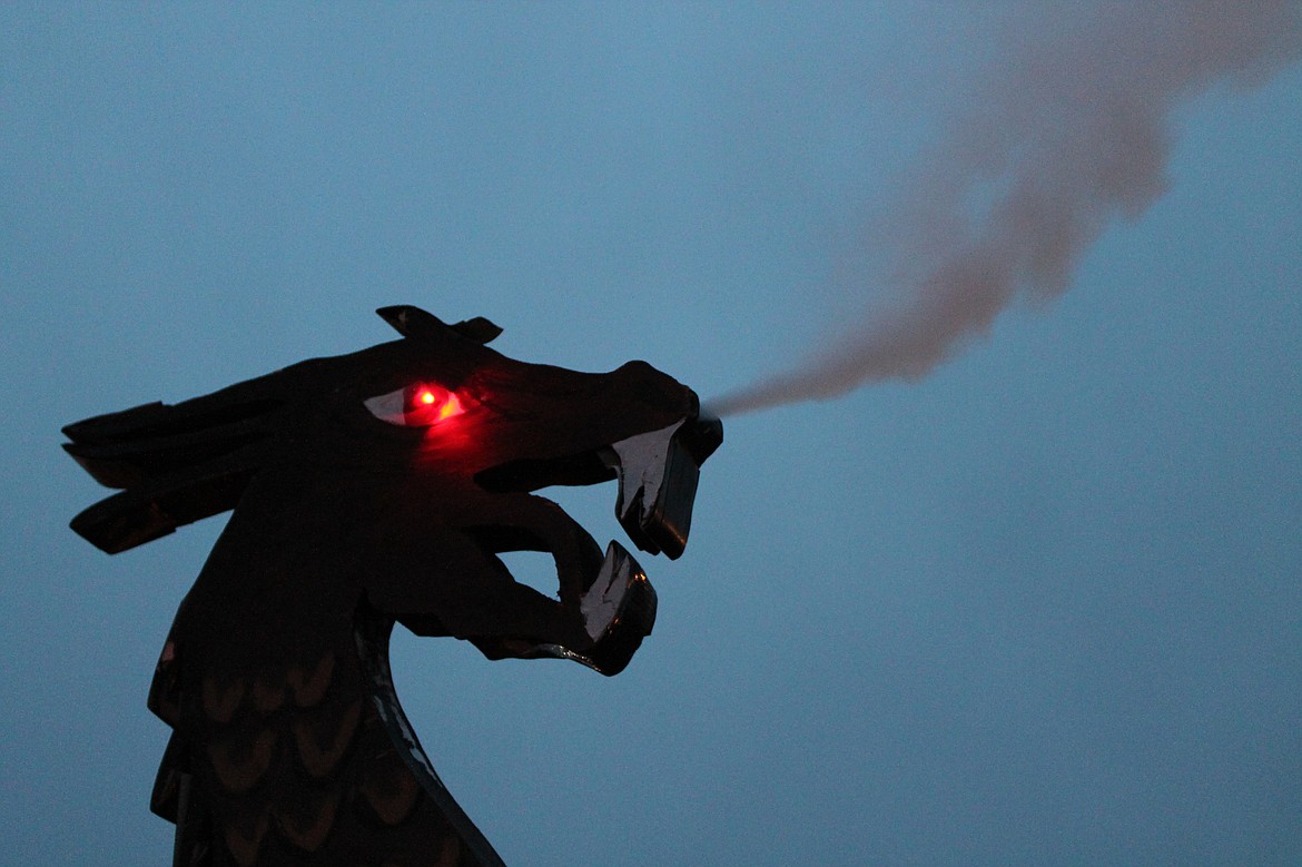 Charles H. Featherstone/Columbia Basin Herald
A wooden dragon on the front of Robert Johnson&#146;s &#147;Sons of Norway&#148; float breathes smoke as the &#147;boat&#148; is readied for the Ag Parade.