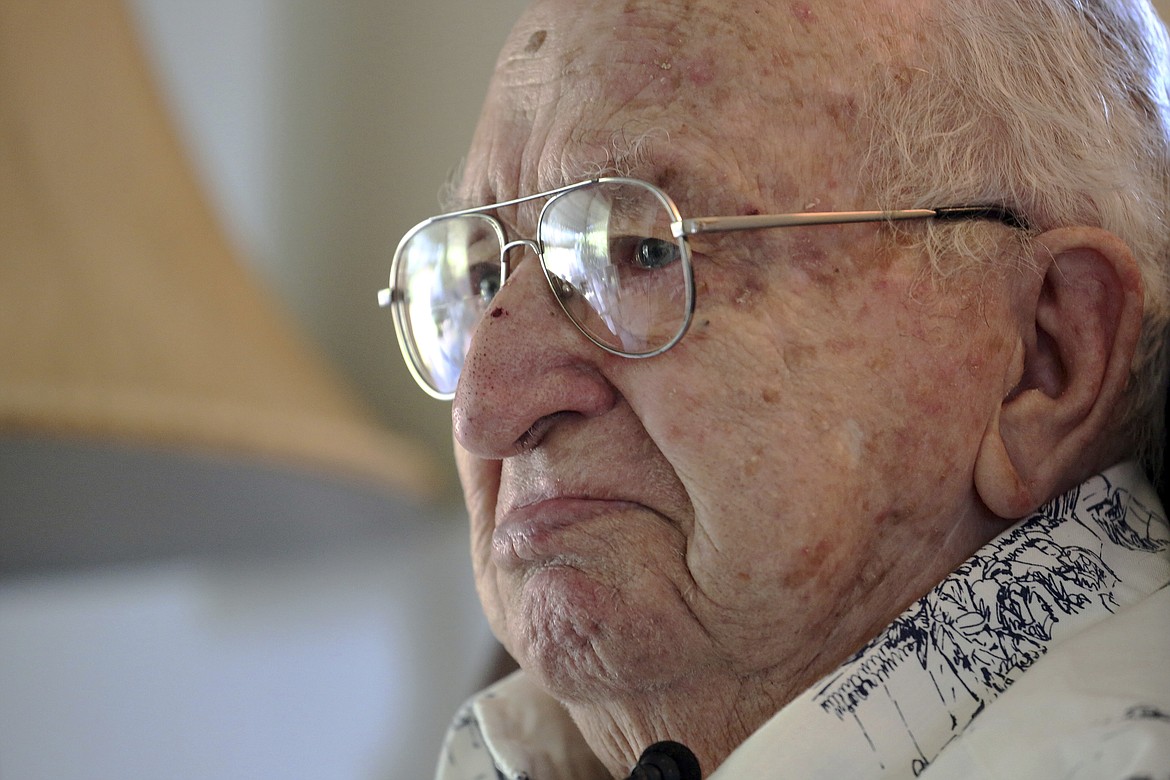 In this Thursday, Nov. 17, 2016 photo, Lauren Bruner, one of five remaining survivors from the USS Arizona during the Dec. 7, 1941 Japanese attack on Pearl Harbor, recounts the experience at his home in La Mirada, Calif. Burns covered most of his body after Japanese planes bombed his ship. He spent seven months recovering in the hospital, and returned to fight in more battles. (AP Photo/Reed Saxon)