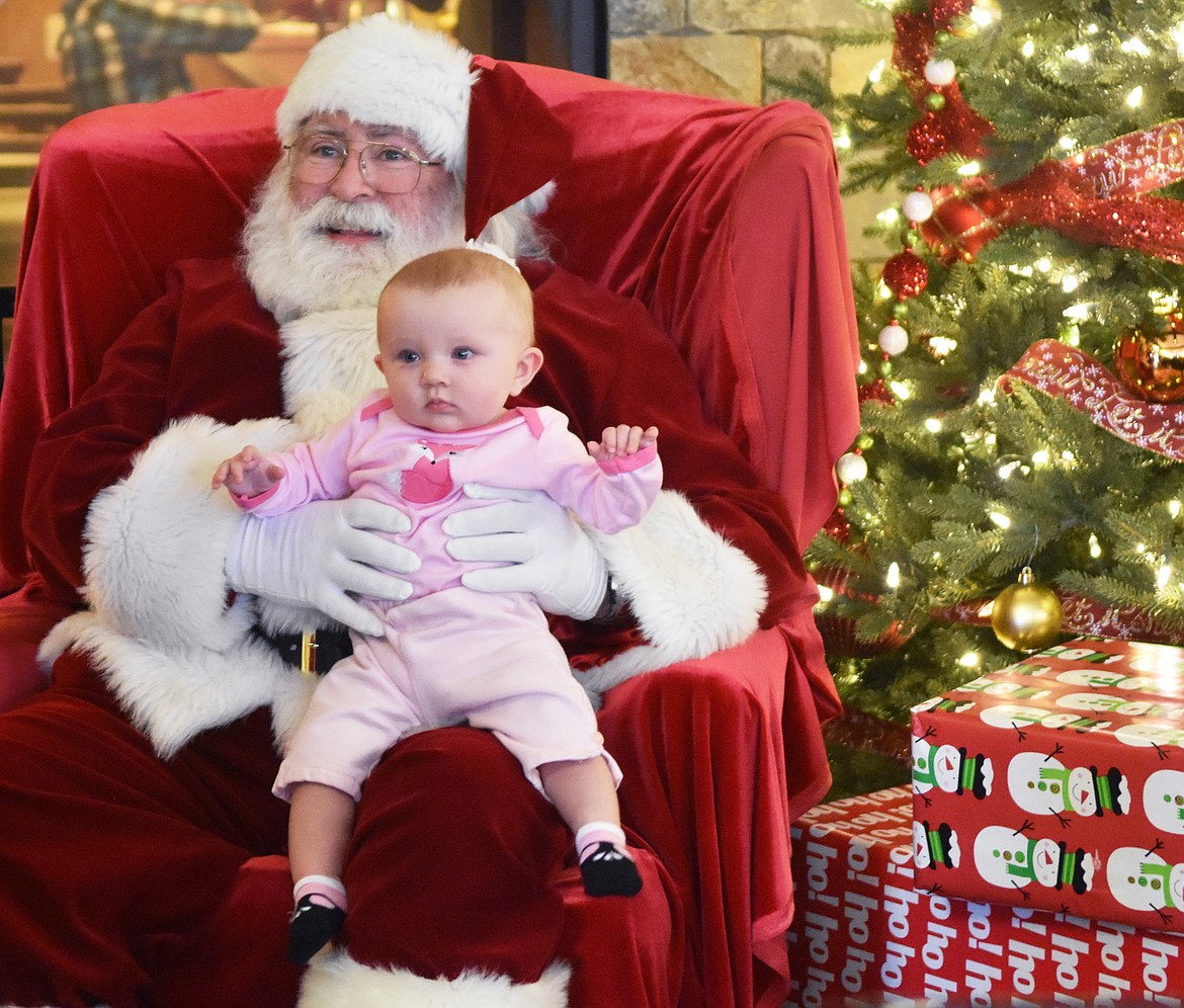 Harlow Ray, 5 months, sits with Santa at The Springs at Whitefish during their Breakfast with Santa event.