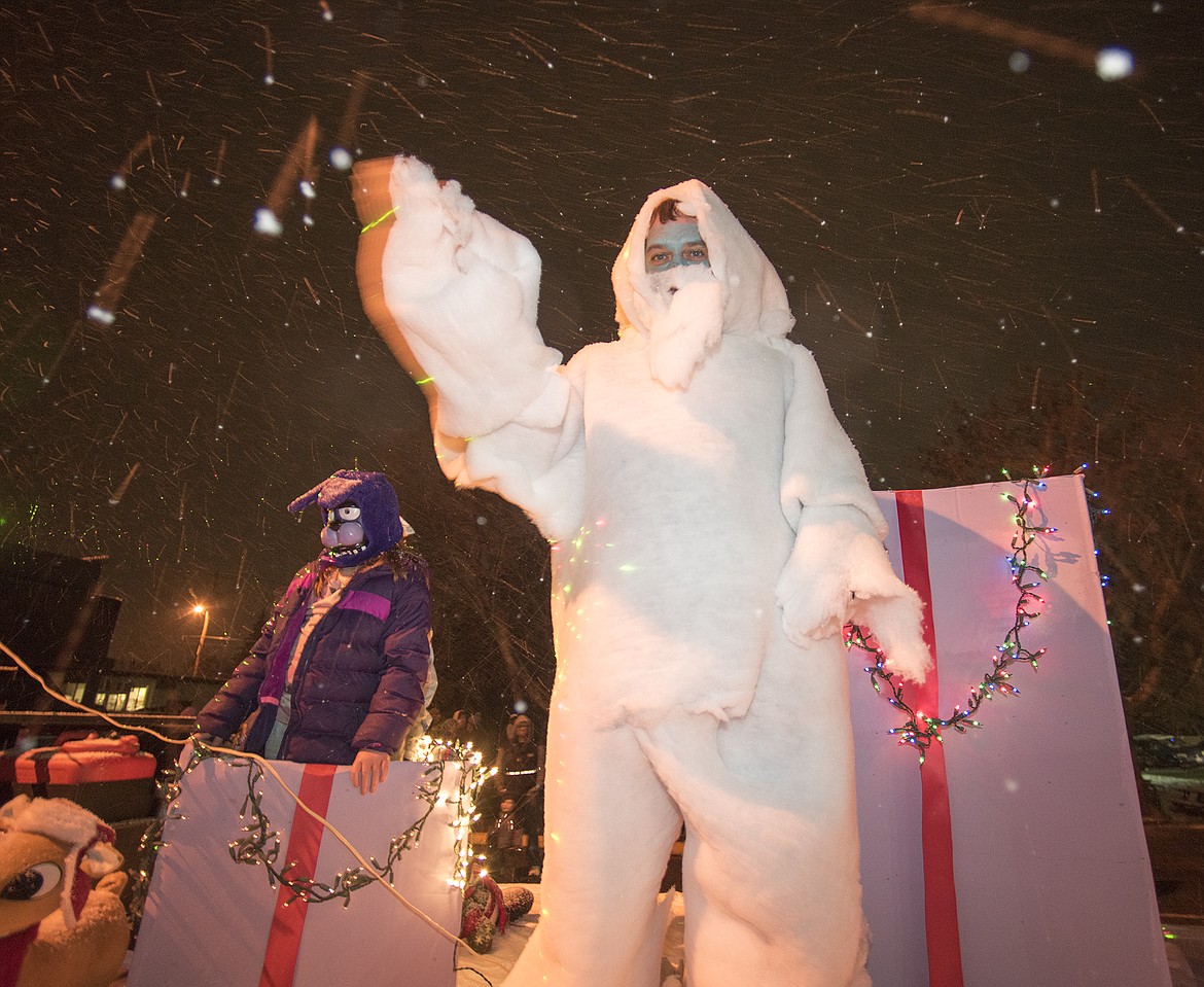 The Abominable snowman waves to the crowd.