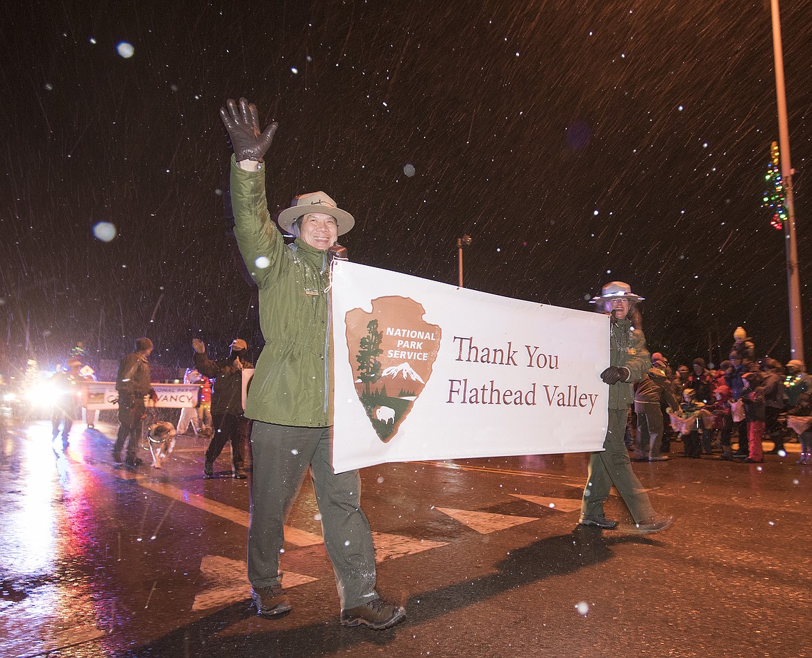 Glacier Park Superintendent Jeff Mow waves to the crowd during the Night of Lights parade.