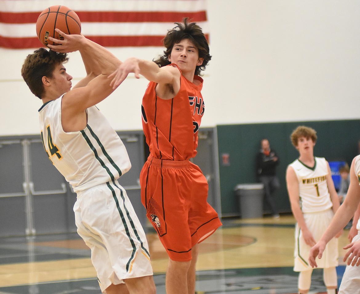 Lee Walburn gets a contested shot off against Flathead.