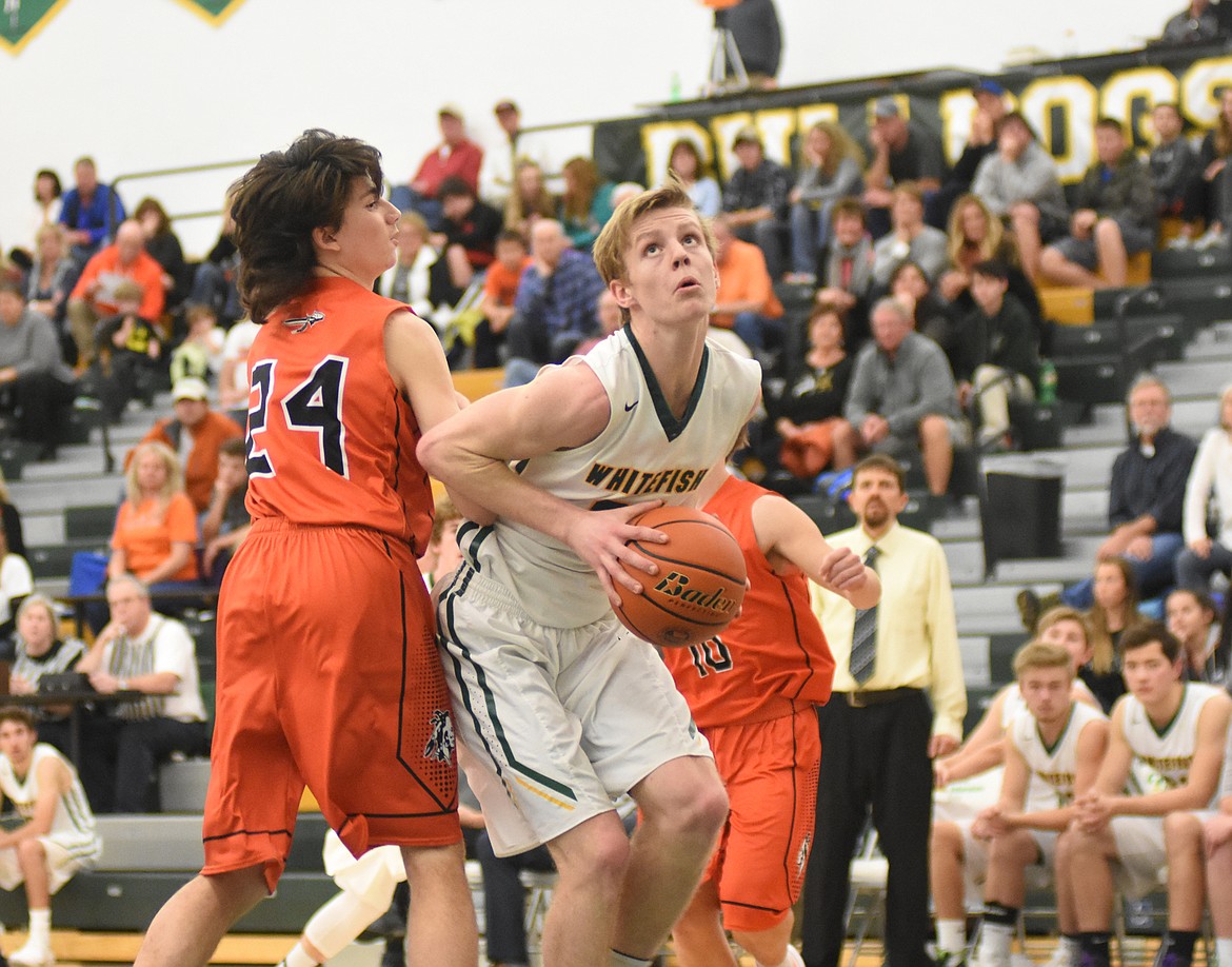 Daniel McKay photos / Whitefish Pilot
Sawyer Silliker posts up a Flathead defender during Saturday&#146;s 52-51 loss.