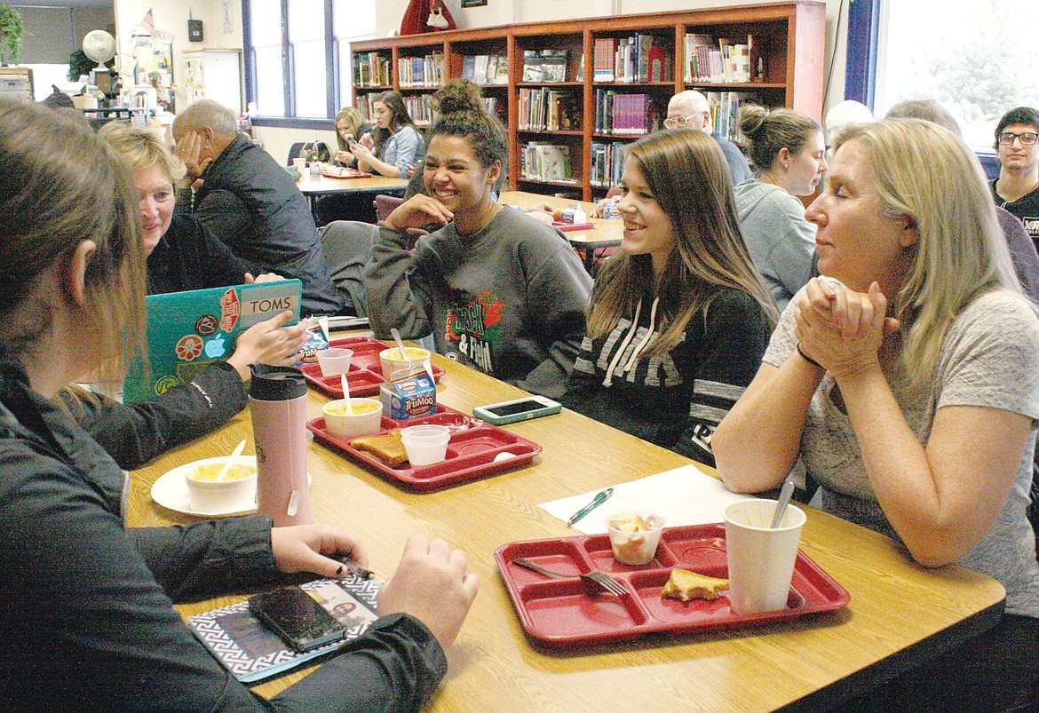 Students Olivia Roach, left, Taylor Carter and mentor Betsy Pierce during the Adult Mentorship Program meeting at Troy High School on Tuesday. (Bethany Rolfson/TWN)