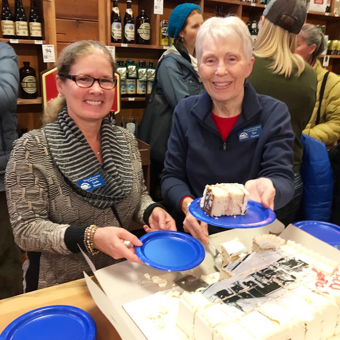 &#151;Courtesy photo
Sandpoint Historic Preservation Commission members hand out cake in celebration of the 100th birthday of the Amtrak train depot. The event, hosted by Idaho Pour Authority, was a rousing success.