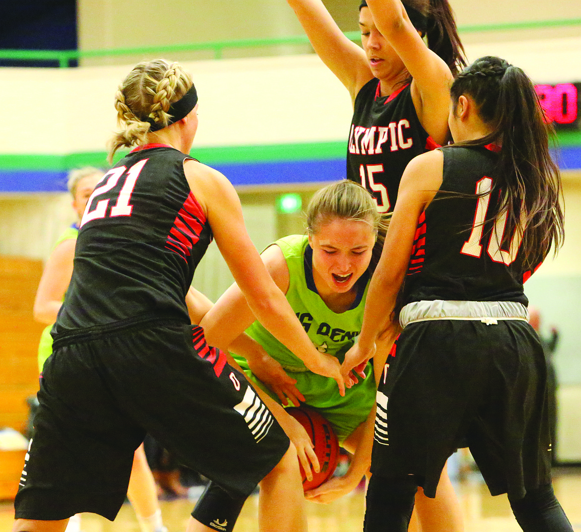 Connor Vanderweyst/Columbia Basin Herald
Big Bend forward Hailey Garrity tries to grab a loose ball in between three Olympic defenders.