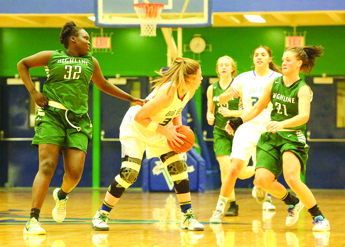 Connor Vanderweyst/Columbia Basin Herald
Big Bend&#146;s Madison Wilcox (center) looks for a pass between two Highline defenders.