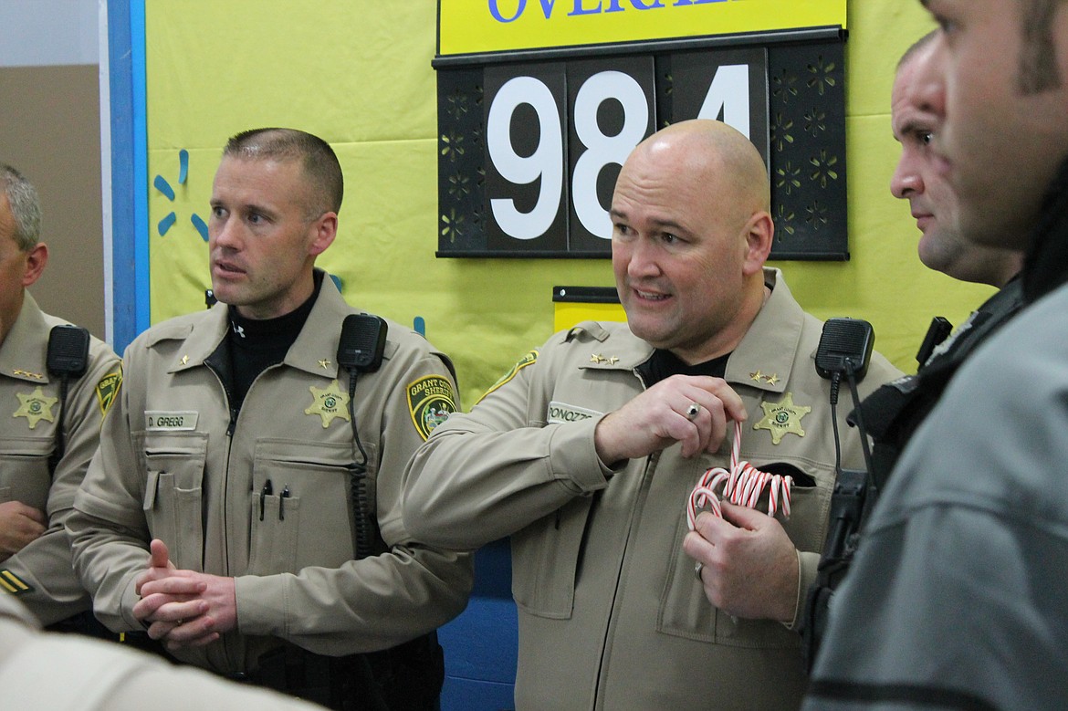 Charles H. Featherstone/Columbia Basin Herald
Chief Deputy Darrik Gregg and Undersheriff Dave Ponozzo get ready to take families shopping on Wednesday at the Walmart in Moses Lake.