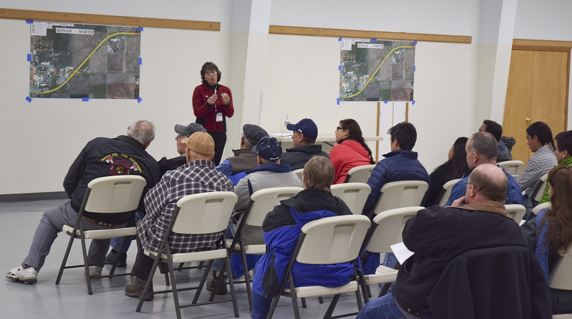 Kathy Harris, a project manger with KLJ, the engineering firm contracted to construct the Ronan highway expansion talks to residents on Dec. 6. (Brett Berntsen/Lake County Leader)