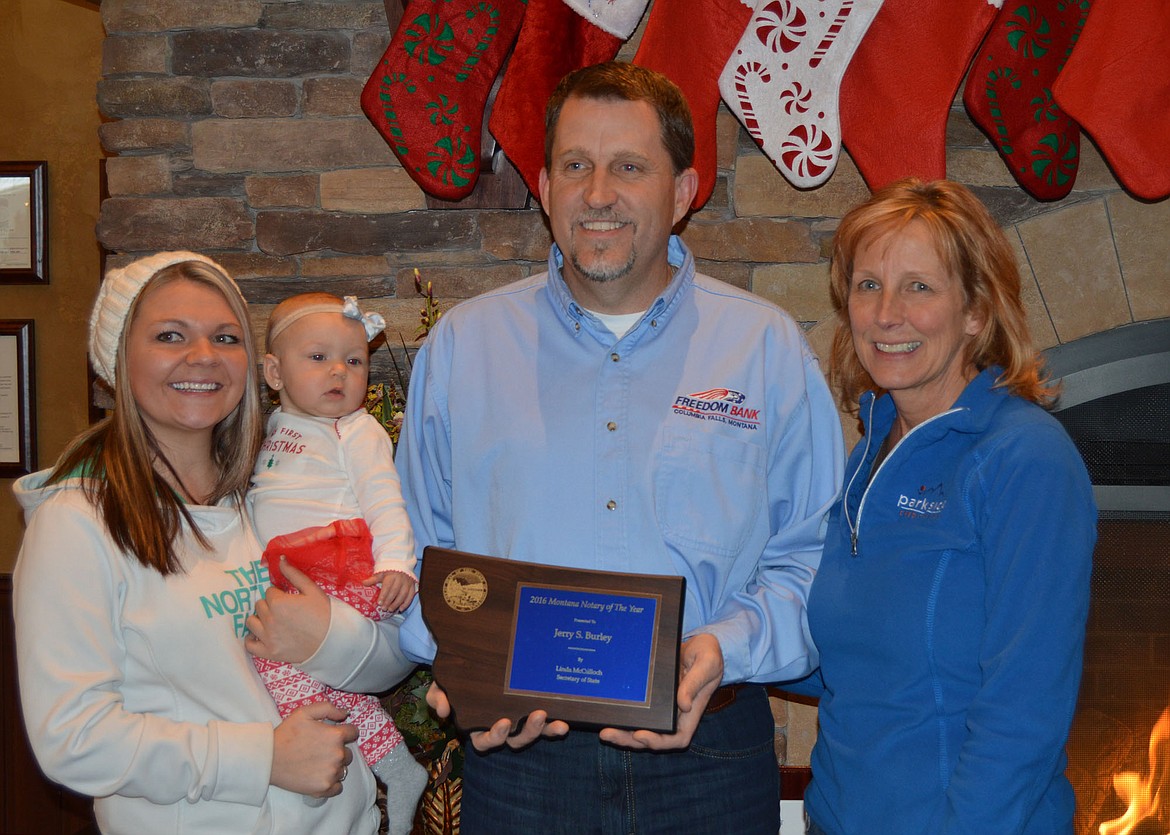 Jerry Burley with daughter Kristen and granddaughter Avery and wife Joanne following the award cermony at Freedom Bank. (Anna Arvidson photo)