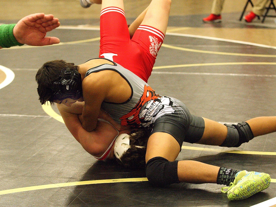 Rodney Harwood/Columbia Basin HeraldEphrata 106-pounder Sammy Flores puts Ryan Marcil of Castle Rock on his back during the championship match at the Royal Rumble on Wednesday. Flores won the title with a pin.