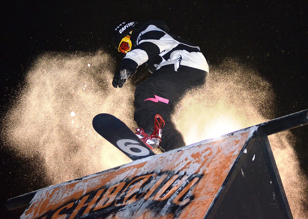 A SNOWBOARDER balances during the New Years Eve Rail Jam at Whitefish Mountain Resort.
(Matt Baldwin photos/This Week in the Flathead)