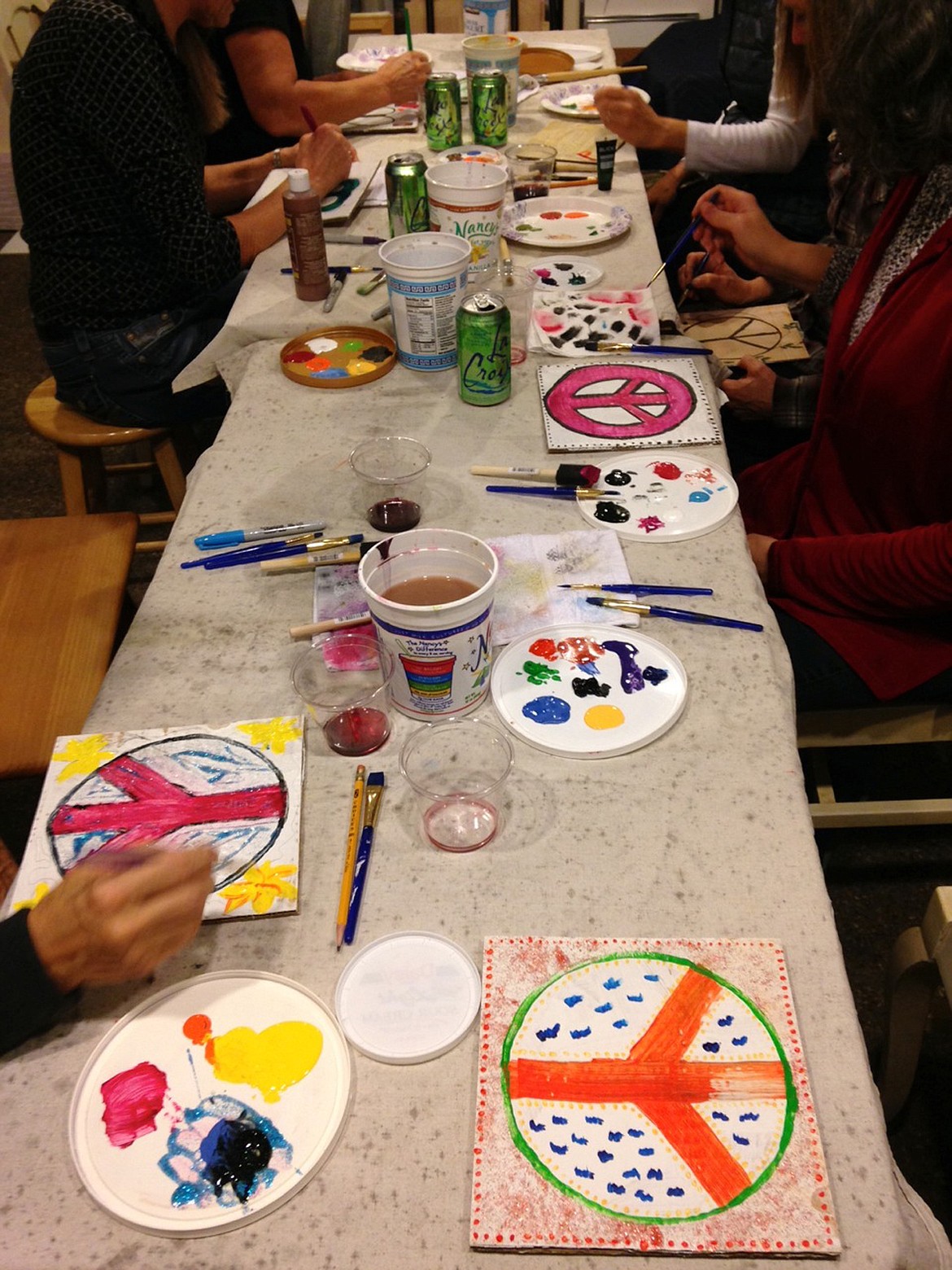 PAINTERS WORK on their postcards at a &#147;Paint with Passion&#148; party.