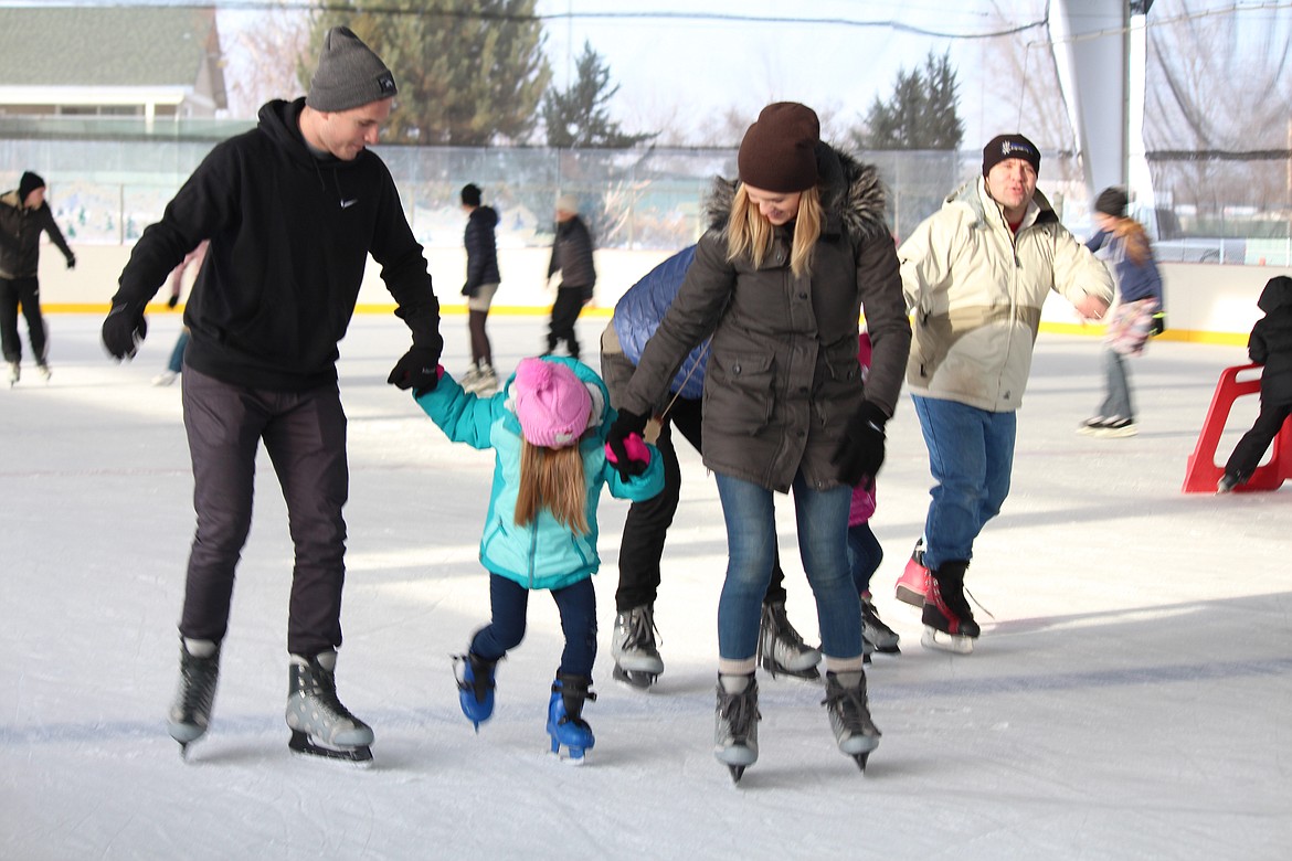 Cheryl Schweizer/Columbia Basin HeraldSome skaters needed help to stay upright while skating at the Larson Ice Rink Monday. The ice rink is one option for families who want to get away from the house during winter break.