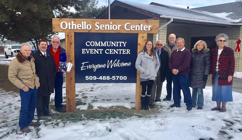 A brand new sign, new landscaping and a refurbished flag pole are highlights of a community effort to spruce up the entrance to the Othello Senior Center. Senate Majority Leader Mark Schoesler presented Roy Dodge, manager of the senior center, with new American and Washington State flags. Several of the individuals involved with the project are pictured here: (left to right) Jim Rogers, Senator Mark Schoesler, Roy Dodge, Jamie Krueger, Pat Simmons, E.R. Kelly, Dale Anderson from Big Bend Electric Cooperative's Caring Neighbors and Barbara Hartwig and Ann Sperl from the Othello Beautification Committee.