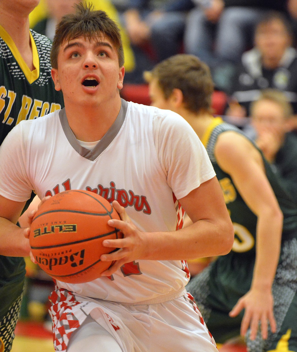 ARLEE Guard Tyler Tanner goes for a layup against the St. Regis defense Thursday night at Arlee High School. (Jason Blasco/Lake County Leader)