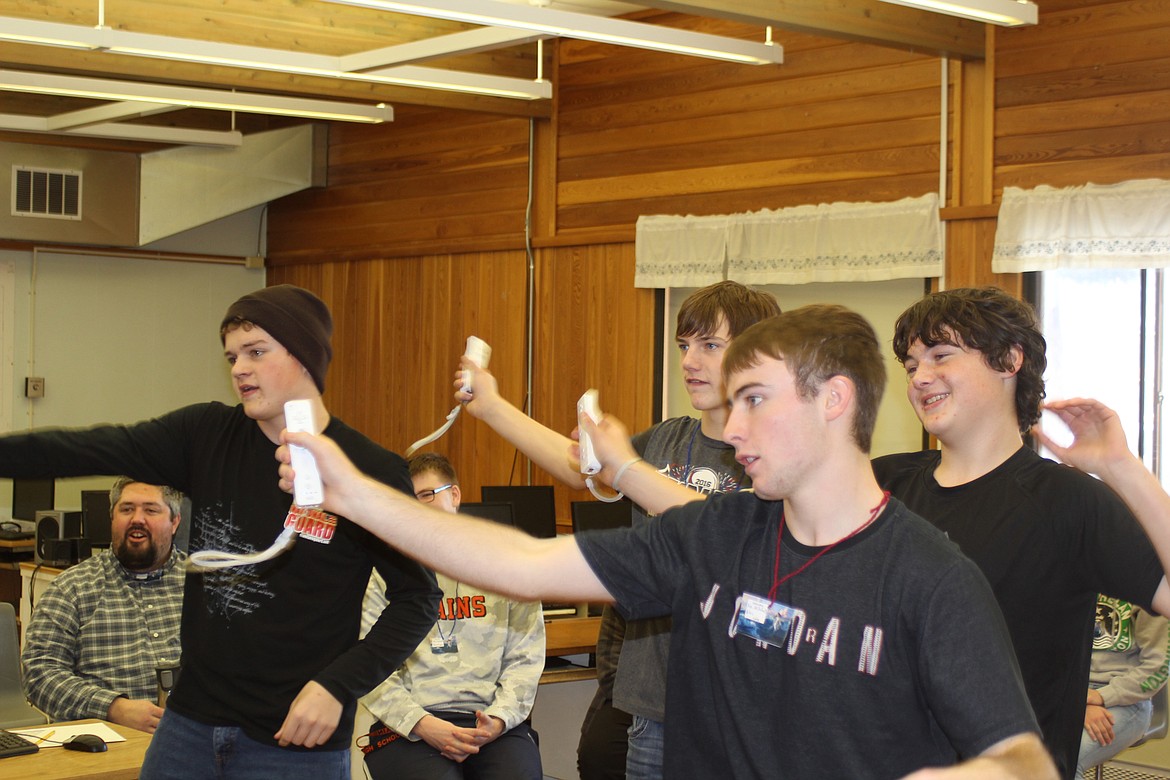 PARTICIPATING IN the Wii dancing game are Noah Hawthorne, Kyle Weeks, Matthew McCracken and Alec Cole. (Douglas Wilks photos/Clark Fork Valley Press)