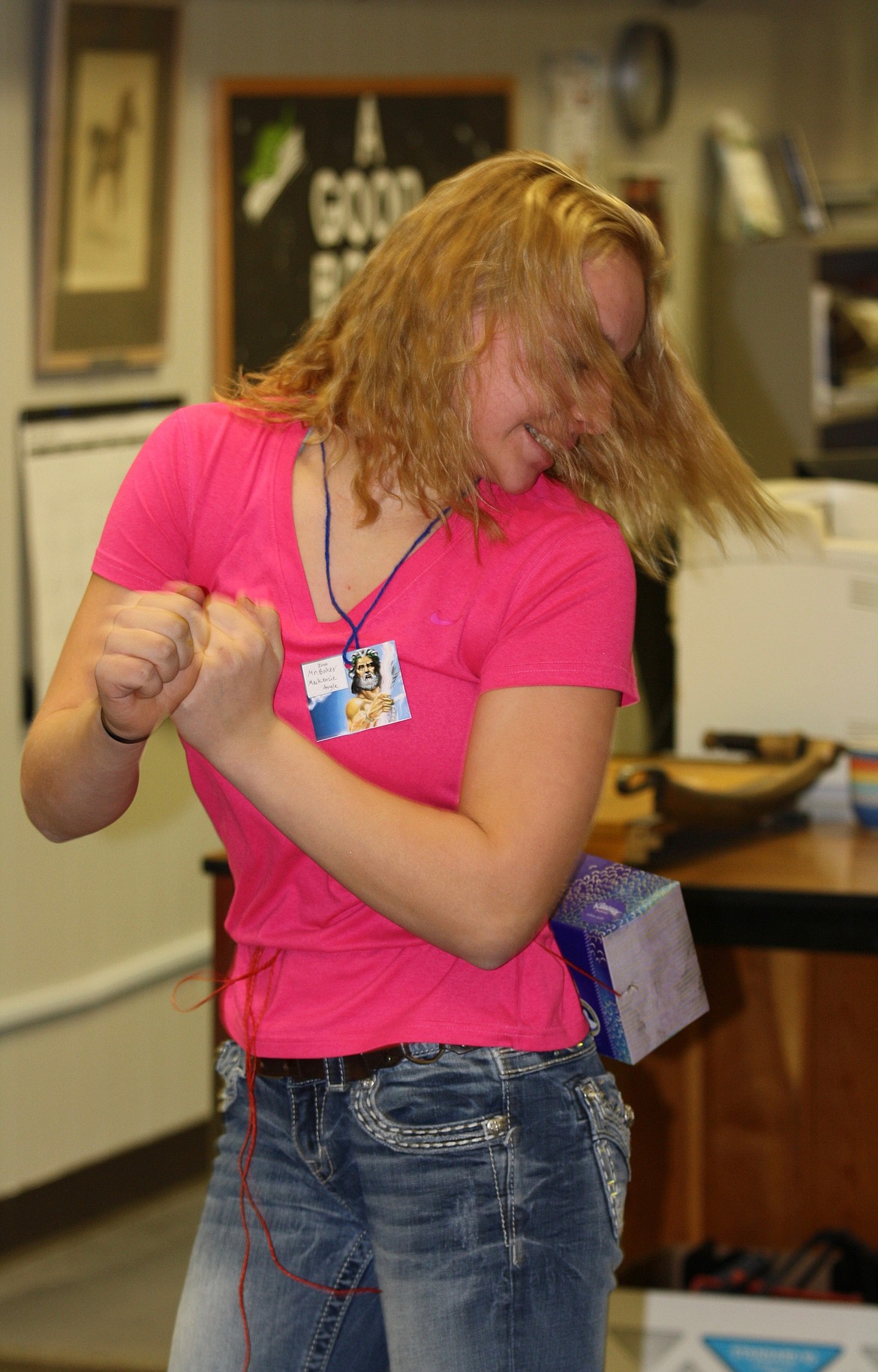 KENZIE ANGLE works on shaking ping-pong balls out of a Kleenex box that is tied around her waist during last week&#146;s Brain Bash.