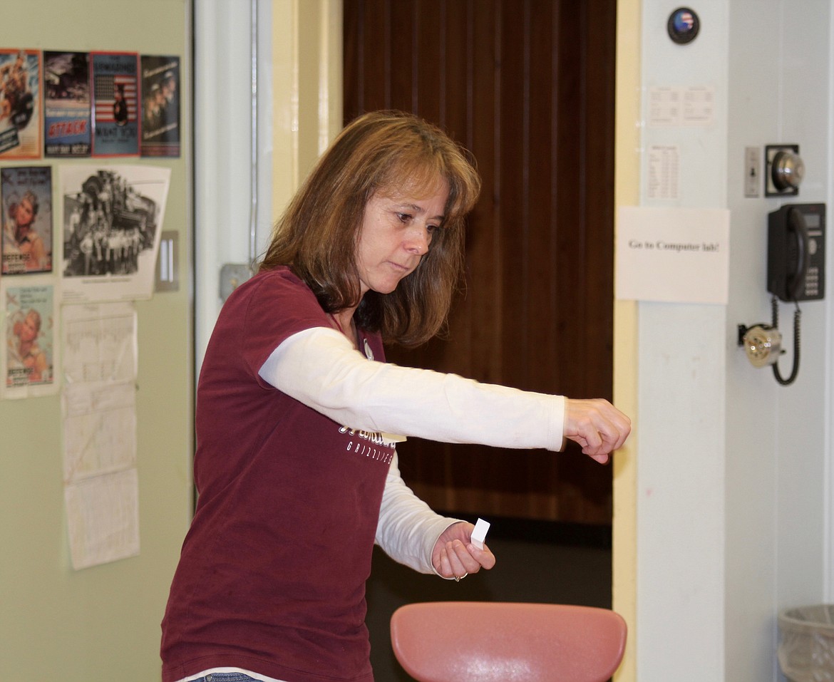 Sandy Revier participates in charades during Brain Bash. (Douglas Wilks/Clark Fork Valley Press)