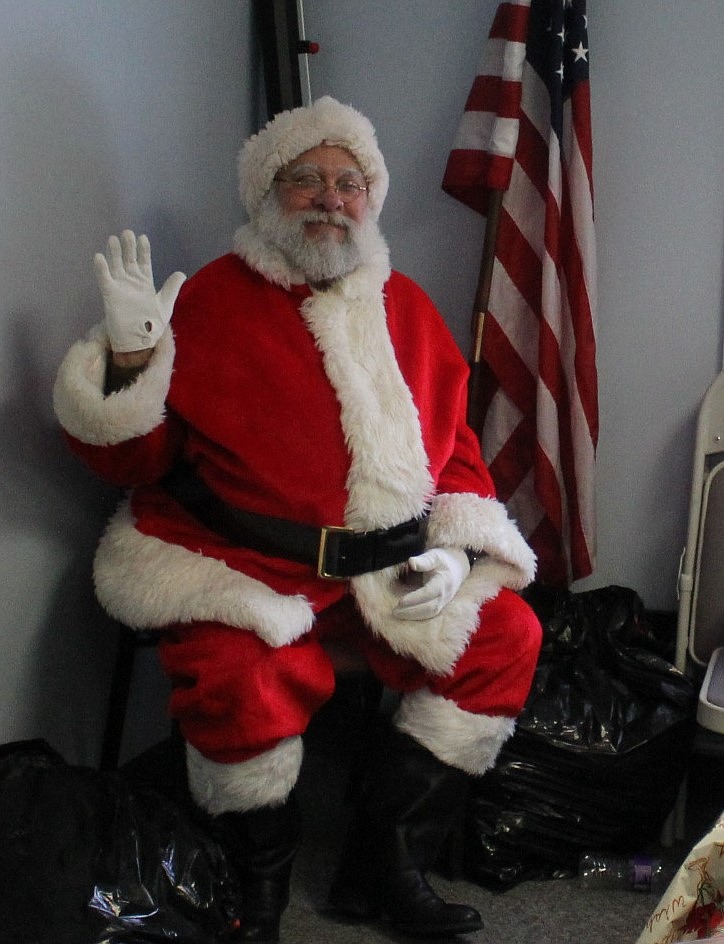 Santa&#146;s helper, Ron Anderson from Superior, was at Trail West Bank last week to take children&#146;s orders for what they wanted for Christmas.(Kathleen Woodford/Mineral Independent)